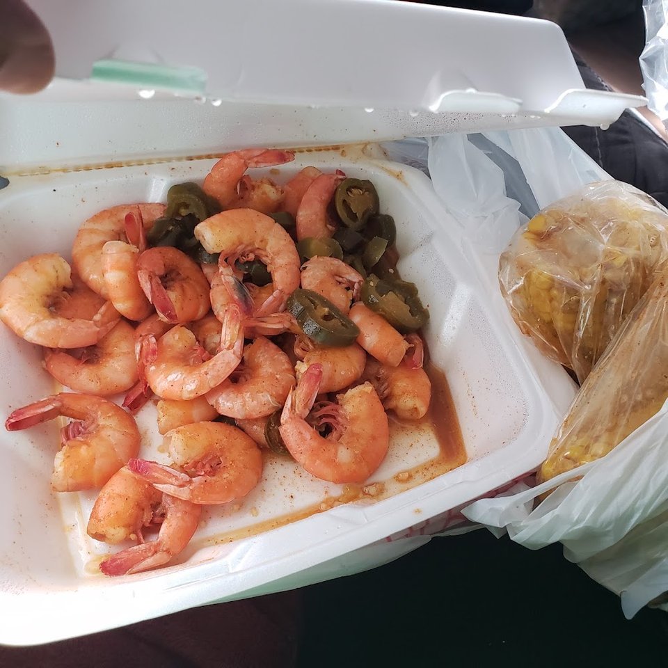Printed menu for seafood and fried plates.