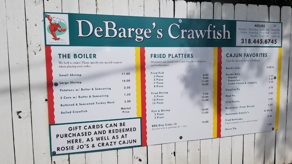 Menu board with Cajun and Creole dishes.
